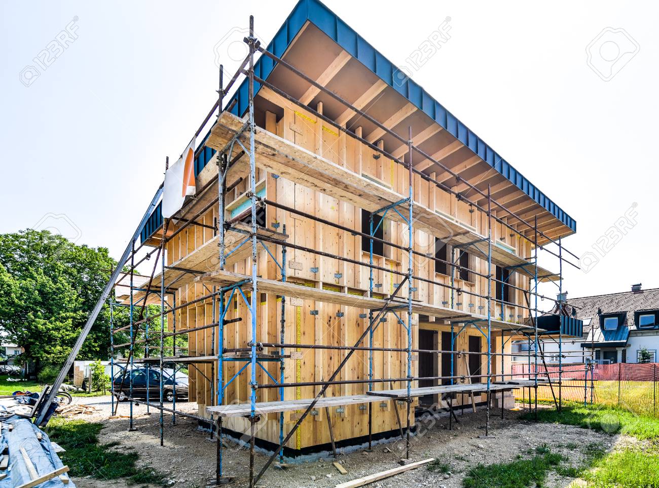 76827593 building energy efficient passive wooden house construction site and exterior of a wooden panel 1